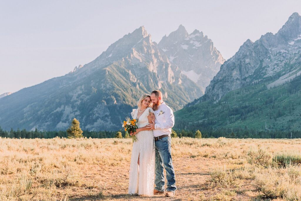 Jackson Hole vow renewal at Cathedral View Turnout intimate mountain vow renewal ceremony Wyoming 10 year anniversary vow renewal Grand Tetons beaded wedding dress mountain vow renewal Cathedral View Turnout vow renewal photographer Grand Teton National Park intimate wedding ceremony