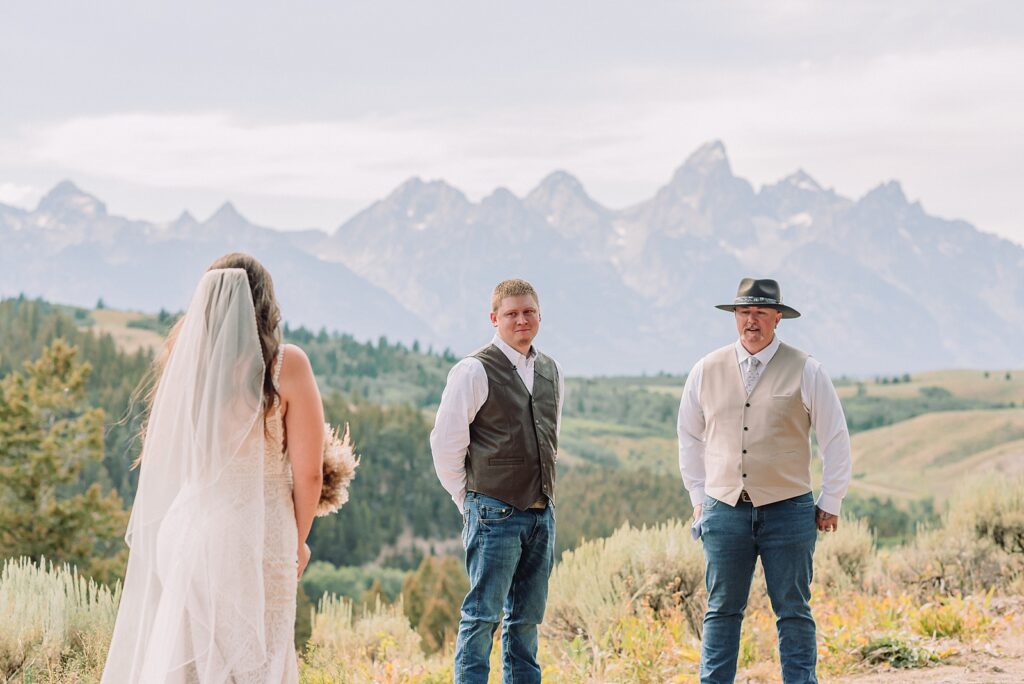 Bridger Teton National Forest outdoor wedding ceremony custom cowboy hat wedding surprise groom gift The Wedding Tree ceremony photos Wyoming champagne toast Grand Teton wedding celebration Jackson Hole Wedding Photographer