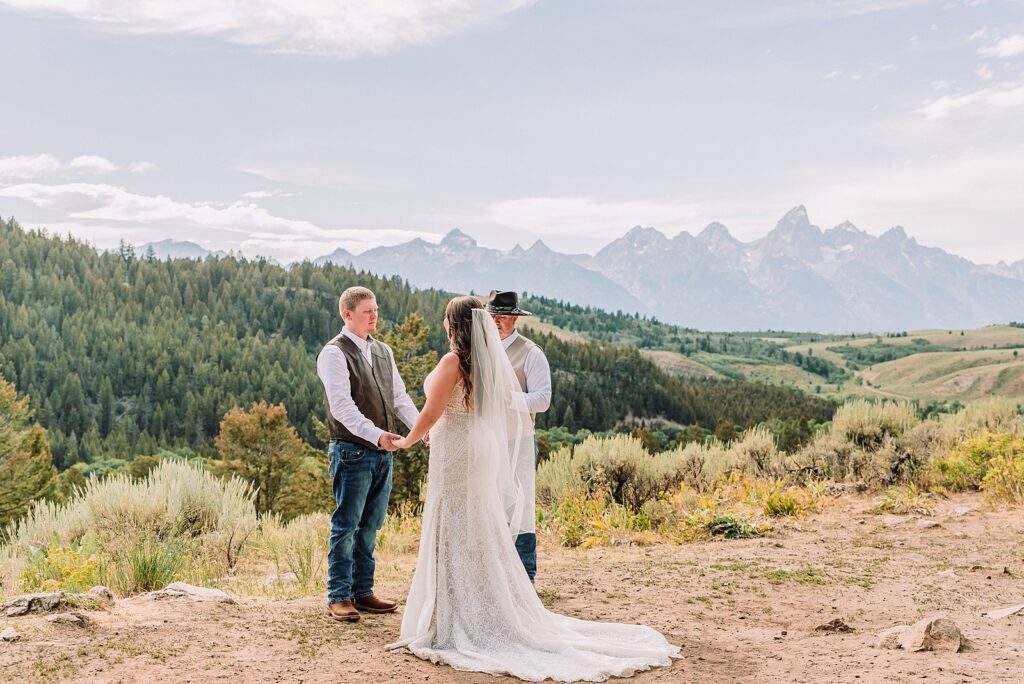 Bridger Teton National Forest outdoor wedding ceremony custom cowboy hat wedding surprise groom gift The Wedding Tree ceremony photos Wyoming champagne toast Grand Teton wedding celebration Jackson Hole Wedding Photographer