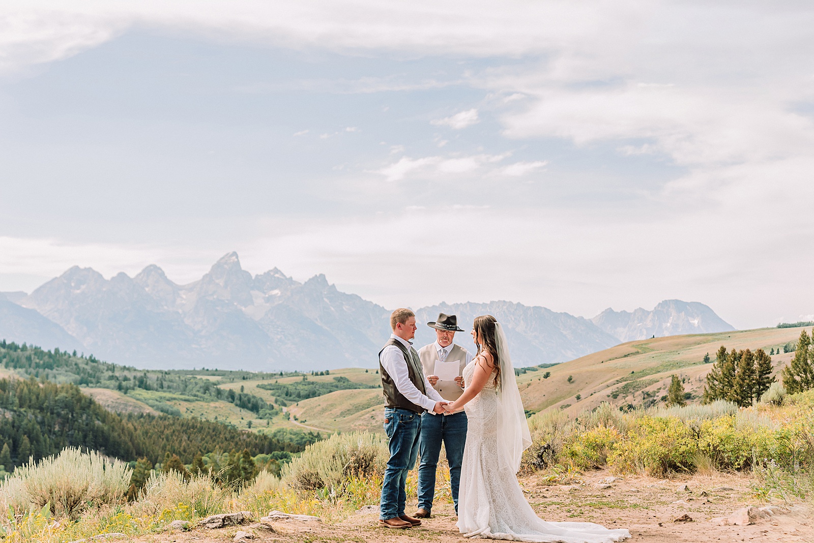 Bridger Teton National Forest outdoor wedding ceremony custom cowboy hat wedding surprise groom gift The Wedding Tree ceremony photos Wyoming champagne toast Grand Teton wedding celebration Jackson Hole Wedding Photographer