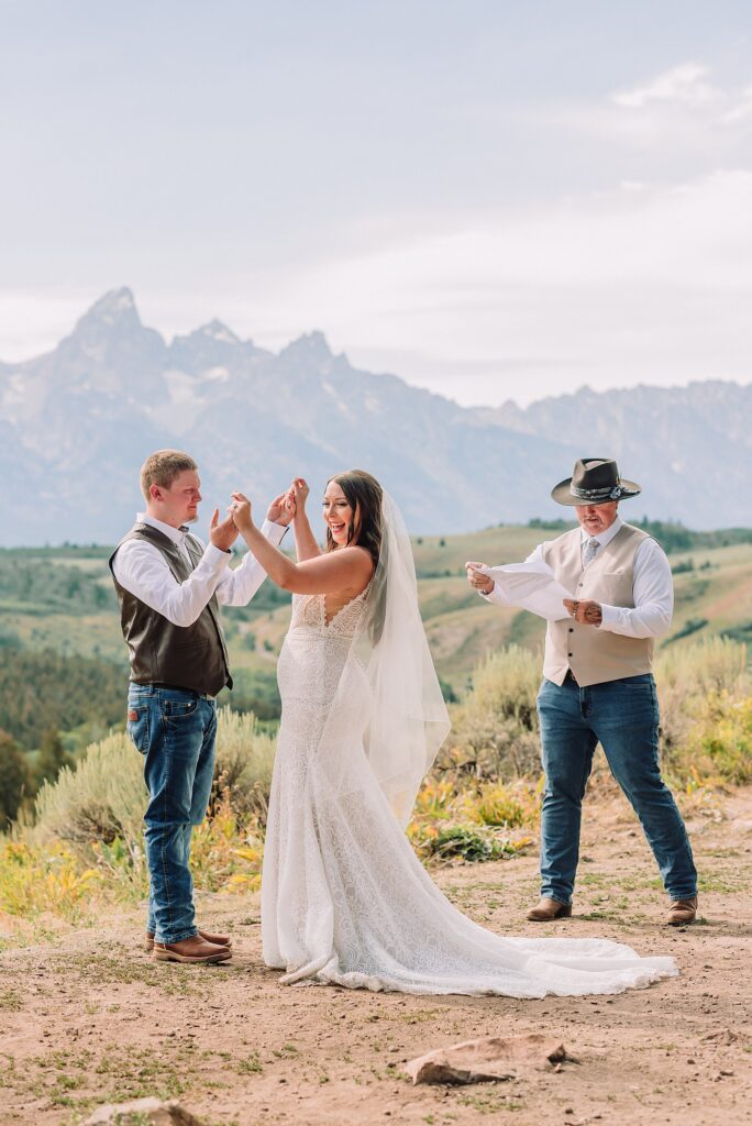 Bridger Teton National Forest outdoor wedding ceremony custom cowboy hat wedding surprise groom gift The Wedding Tree ceremony photos Wyoming champagne toast Grand Teton wedding celebration Jackson Hole Wedding Photographer