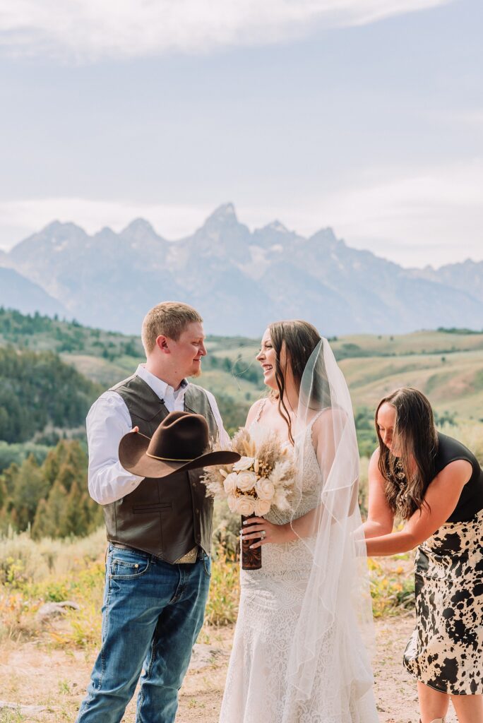 Bridger Teton National Forest outdoor wedding ceremony custom cowboy hat wedding surprise groom gift The Wedding Tree ceremony photos Wyoming champagne toast Grand Teton wedding celebration Jackson Hole Wedding Photographer