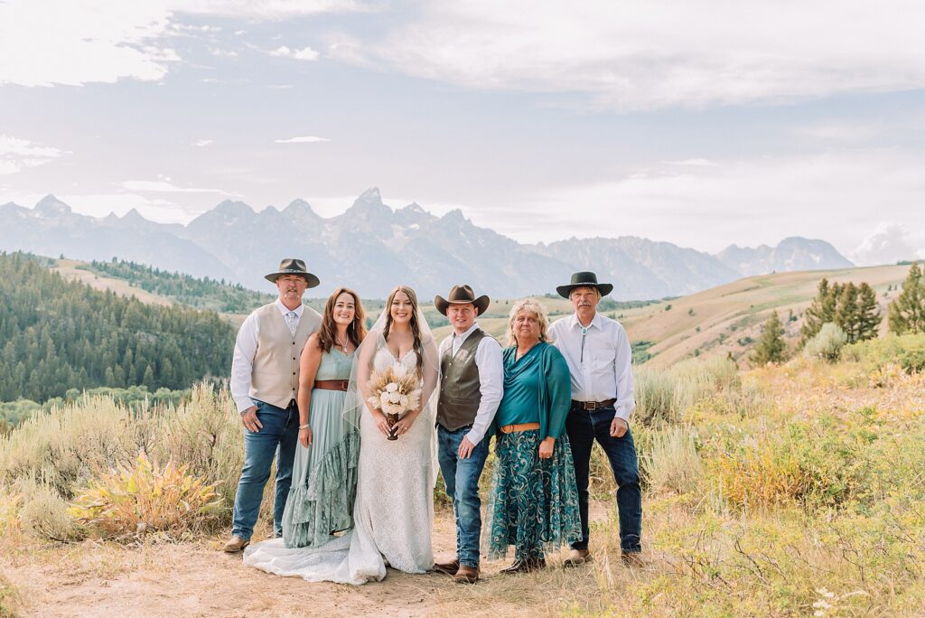 Bridger Teton National Forest outdoor wedding ceremony custom cowboy hat wedding surprise groom gift The Wedding Tree ceremony photos Wyoming champagne toast Grand Teton wedding celebration Jackson Hole Wedding Photographer