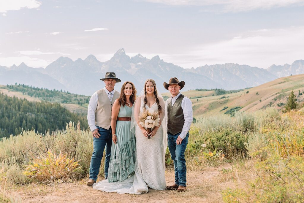 Bridger Teton National Forest outdoor wedding ceremony custom cowboy hat wedding surprise groom gift The Wedding Tree ceremony photos Wyoming champagne toast Grand Teton wedding celebration Jackson Hole Wedding Photographer