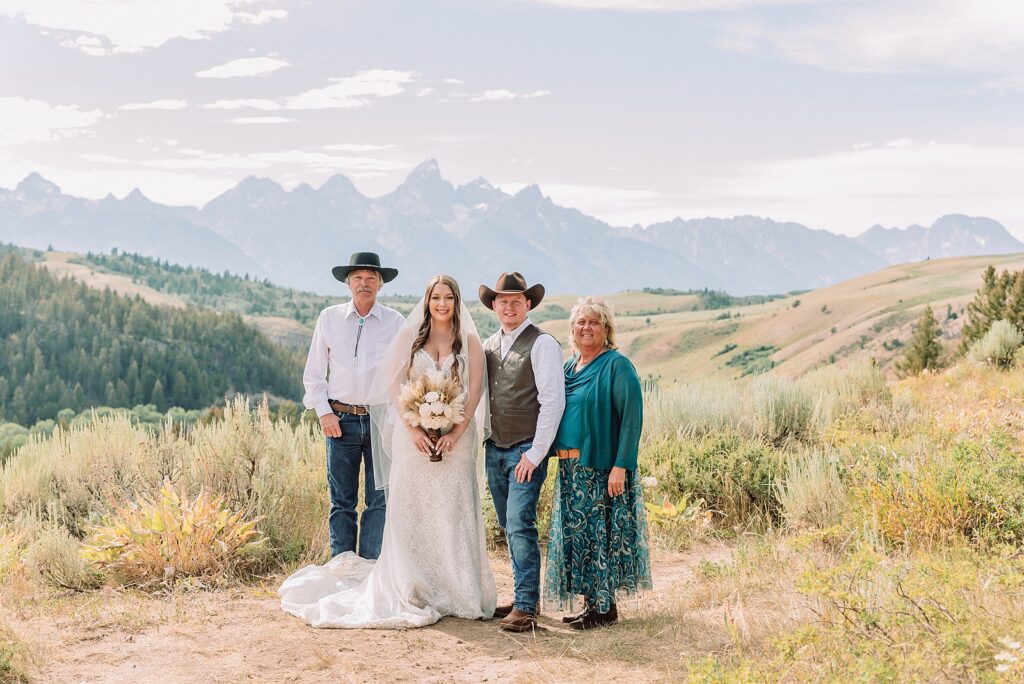 Bridger Teton National Forest outdoor wedding ceremony custom cowboy hat wedding surprise groom gift The Wedding Tree ceremony photos Wyoming champagne toast Grand Teton wedding celebration Jackson Hole Wedding Photographer