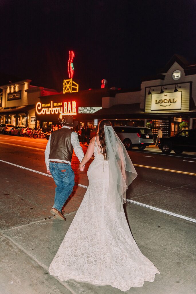 Million Dollar Cowboy Bar wedding photos Million Dollar Cowboy Bar neon sign wedding photos Jackson Hole Wedding Photographer