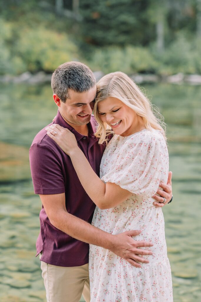 String Lake engagement photos in Grand Teton National Park Jackson Hole mountain engagement photography Teton engagement session at String Lake cream floral dress engagement photos Jackson Wyoming LDS temple wedding engagement photos Tetons fall engagement photo outfits Jackson Hole String Lake Wyoming couple photography session