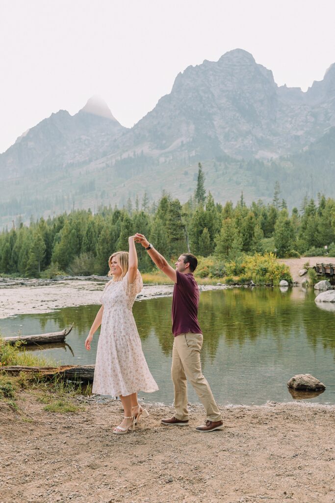 String Lake engagement photos in Grand Teton National Park Jackson Hole mountain engagement photography Teton engagement session at String Lake cream floral dress engagement photos Jackson Wyoming LDS temple wedding engagement photos Tetons fall engagement photo outfits Jackson Hole String Lake Wyoming couple photography session