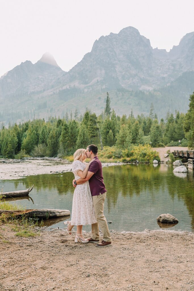 String Lake engagement photos in Grand Teton National Park Jackson Hole mountain engagement photography Teton engagement session at String Lake cream floral dress engagement photos Jackson Wyoming LDS temple wedding engagement photos Tetons fall engagement photo outfits Jackson Hole String Lake Wyoming couple photography session