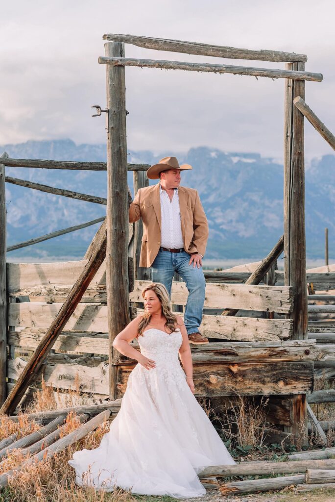 Mormon Row barn elopement photos with Grand Teton mountains fall elopement portraits at Mormon Row historic barns cowboy hat groom Mormon Row wedding photos Schwabacher Landing elopement reflection photos elopement ceremony Jackson Hole
