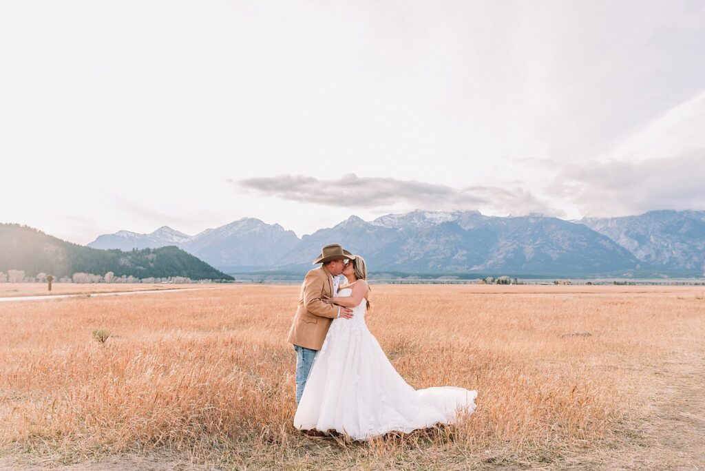 Schwabacher Landing elopement reflection photos elopement ceremony Jackson Hole October elopement at Mormon Row golden fields intimate Grand Teton elopement at Mormon Row