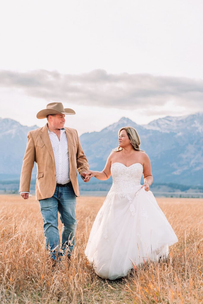 Schwabacher Landing elopement reflection photos elopement ceremony Jackson Hole October elopement at Mormon Row golden fields intimate Grand Teton elopement at Mormon Row