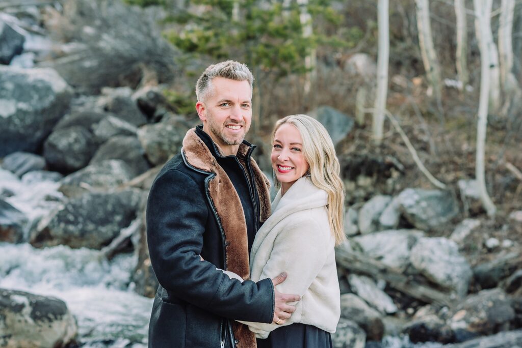 Taggart Lake engagement photography Jackson Hole Wyoming Grand Teton couples anniversary photos spring session Wyoming mountain bridge waterfall couple portraits Luxury western couples photography Jackson Hole Early season mountain engagement photos Tetons