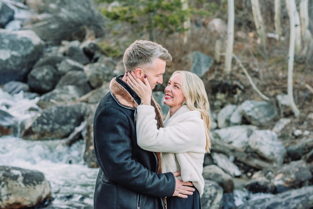 Taggart Lake engagement photography Jackson Hole Wyoming Grand Teton couples anniversary photos spring session Wyoming mountain bridge waterfall couple portraits Luxury western couples photography Jackson Hole Early season mountain engagement photos Tetons
