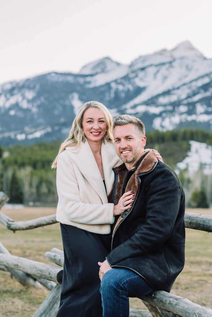 Luxury western couples photography Jackson Hole Early season mountain engagement photos Tetons Taggart Lake trailhead anniversary photography session Cascade bridge couples portraits Grand Teton National Park Faux fur coat mountain couples photoshoot Wyoming