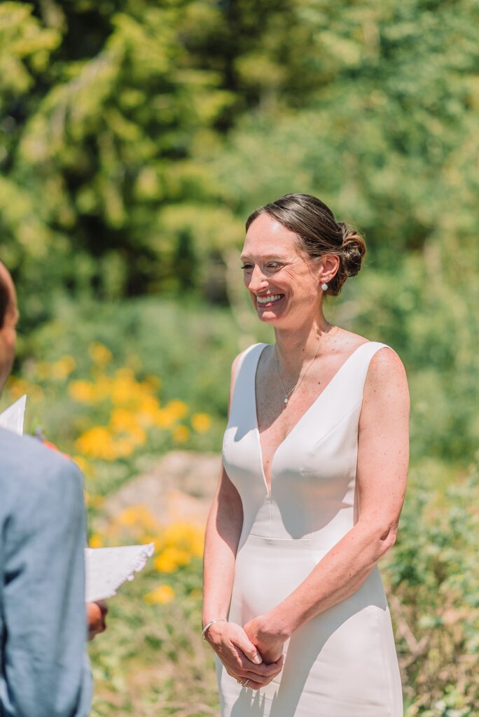 intimate Jackson Hole wedding photography The Wedding Tree ceremony photos Wyoming Wyoming mountain elopement at Wedding Tree June wildflower wedding ceremony Grand Tetons Wedding Tree elopement photographer Grand Teton National Park wildflower bouquet mountain wedding photography