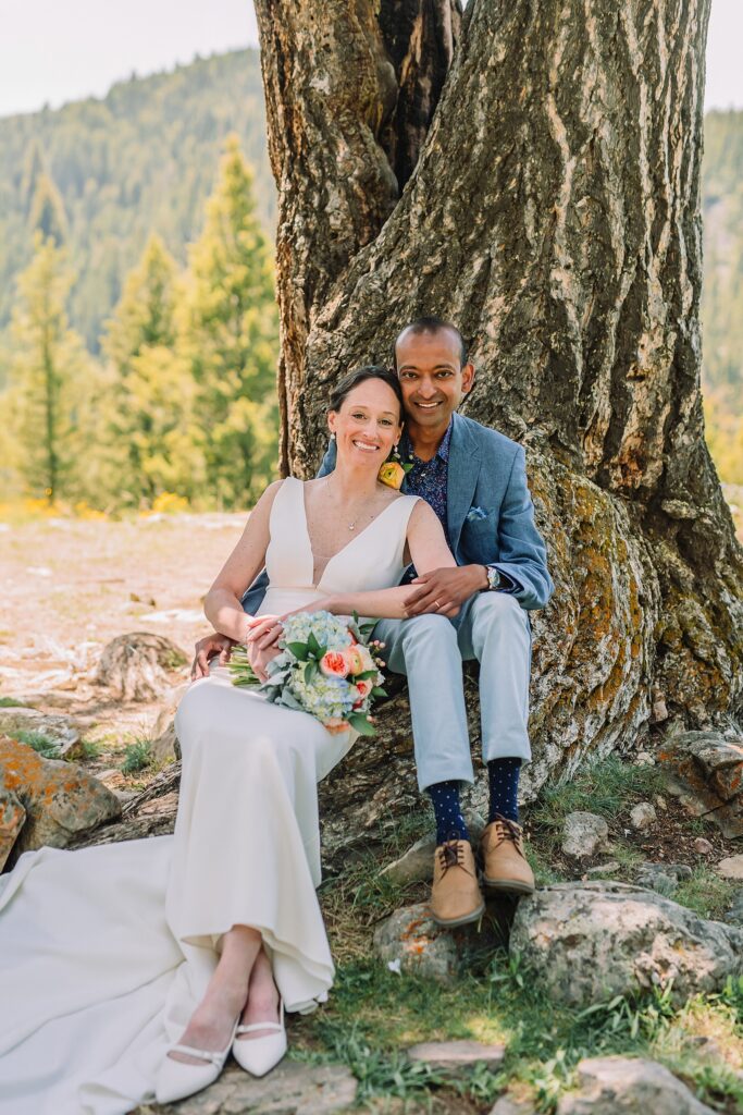 intimate Jackson Hole wedding photography The Wedding Tree ceremony photos Wyoming Wyoming mountain elopement at Wedding Tree June wildflower wedding ceremony Grand Tetons Wedding Tree elopement photographer Grand Teton National Park wildflower bouquet mountain wedding photography
