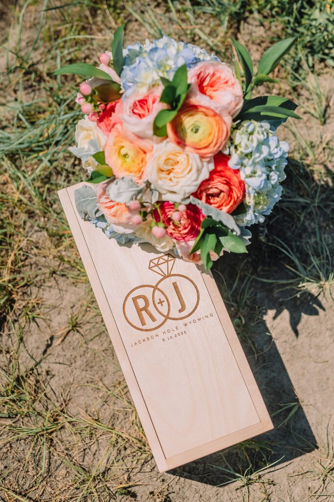 intimate elopement photography Schwabacher Landing champagne toast at Wyoming elopement personalized coffee mug elopement surprise mountain wedding with snow capped Teton peaks Jackson Hole destination wedding photographer Grand Teton elopement photography session