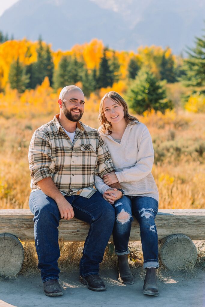 Teton mountain engagement photography with fall colors Schwabacher Landing engagement session autumn Casual mountain engagement photos with jeans Fall engagement session Grand Tetons Wyoming Cream sweater engagement photos mountain backdrop