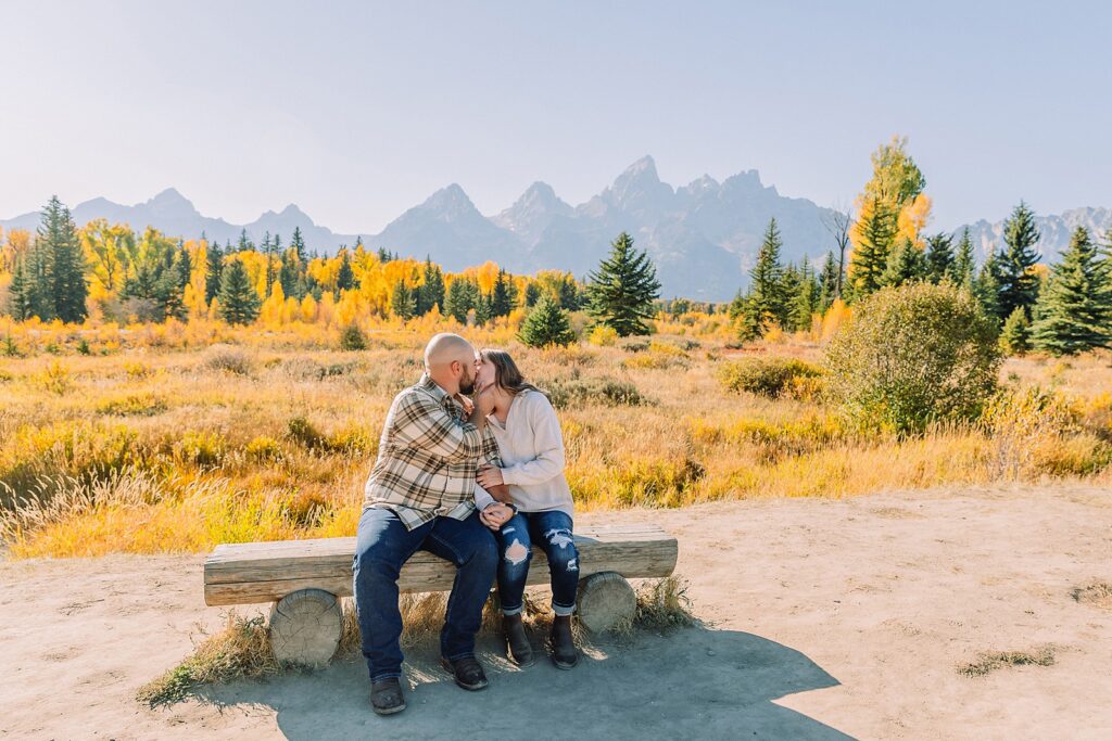 Teton mountain engagement photography with fall colors Schwabacher Landing engagement session autumn Casual mountain engagement photos with jeans Fall engagement session Grand Tetons Wyoming Cream sweater engagement photos mountain backdrop