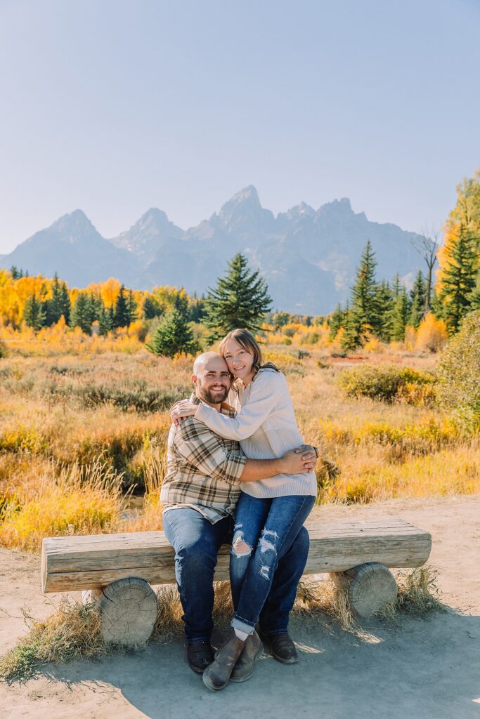 Teton mountain engagement photography with fall colors Schwabacher Landing engagement session autumn Casual mountain engagement photos with jeans Fall engagement session Grand Tetons Wyoming Cream sweater engagement photos mountain backdrop