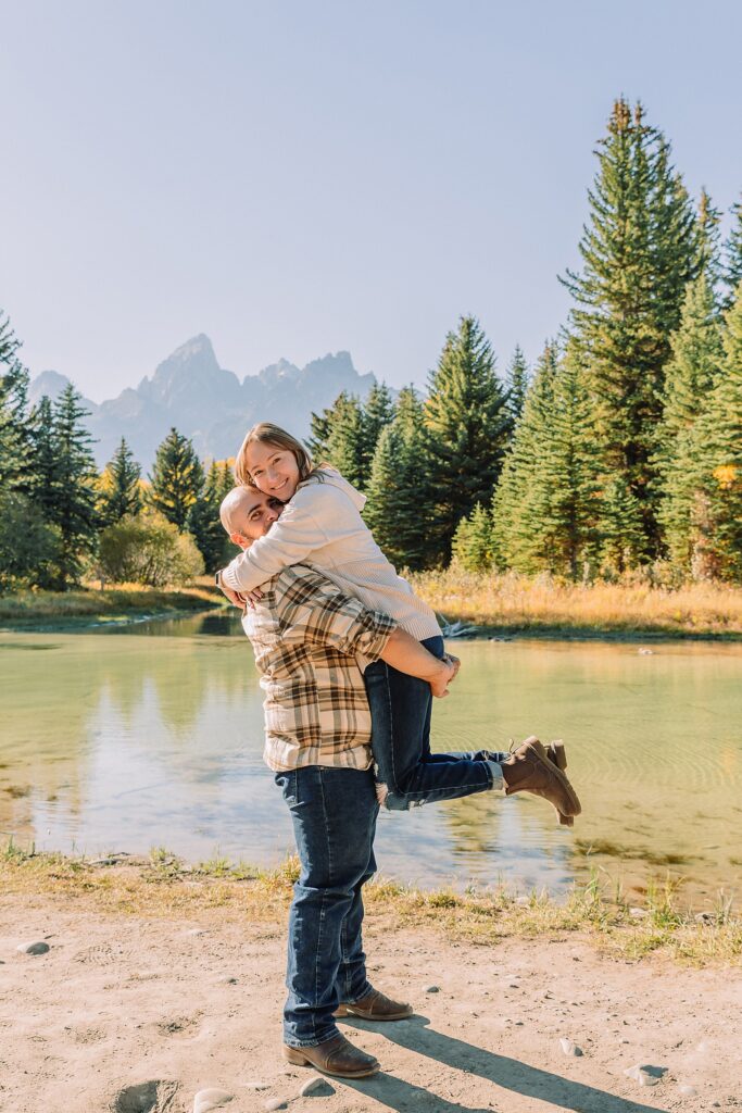 Buckrail fence rustic engagement portraits September Teton engagement photography golden hour Candid mountain couple photos engagement session Jackson Hole Photographer