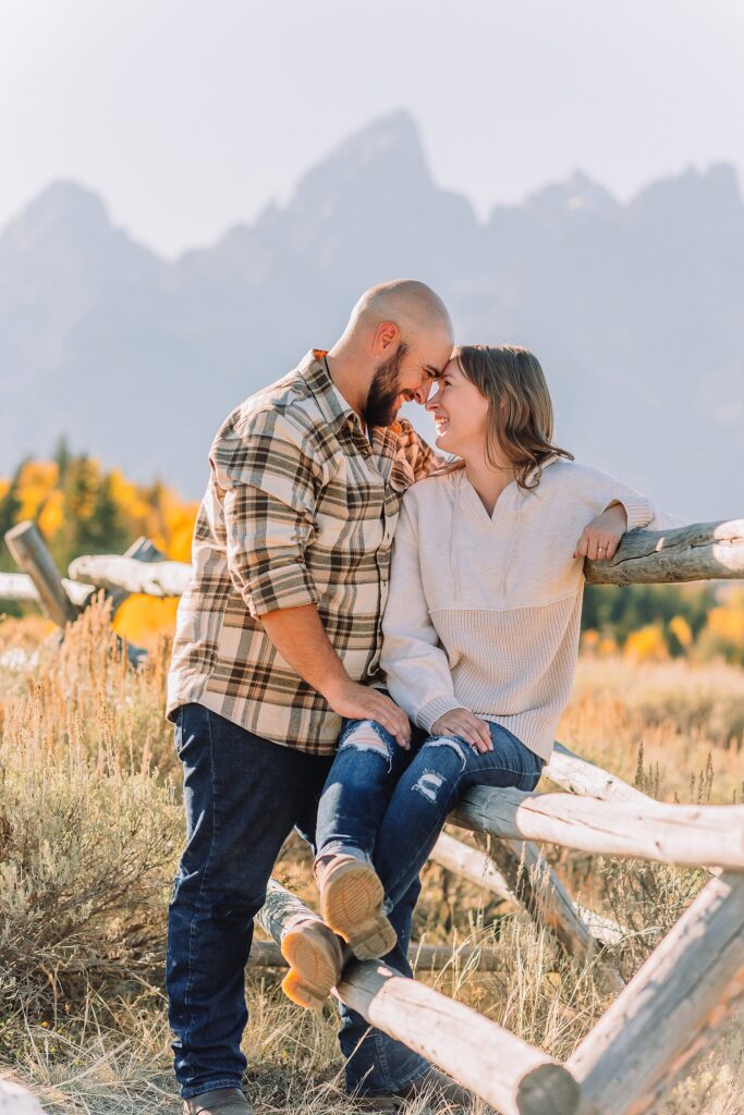 Casual mountain engagement photos with jeans Fall engagement session Grand Tetons Wyoming Cream sweater engagement photos mountain backdrop September Teton engagement photography golden hour Candid mountain couple photos engagement session