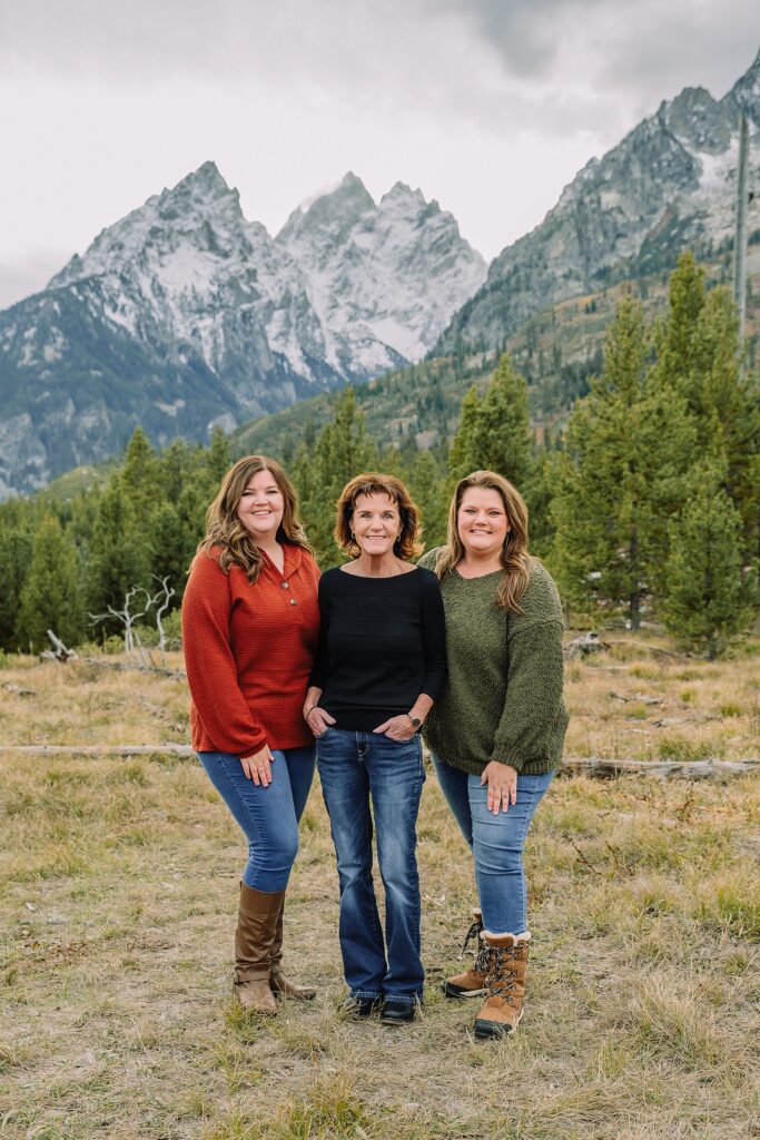 extended family photos in Jackson Hole Wyoming String Lake family photography session Jackson Hole multi generational family portraits in the mountains Grand Teton National Park family photographer windy mountain family session Jackson Hole Arizona family visiting Jackson Hole photos three generation family photos at String Lake Jackson Hole extended family photographer