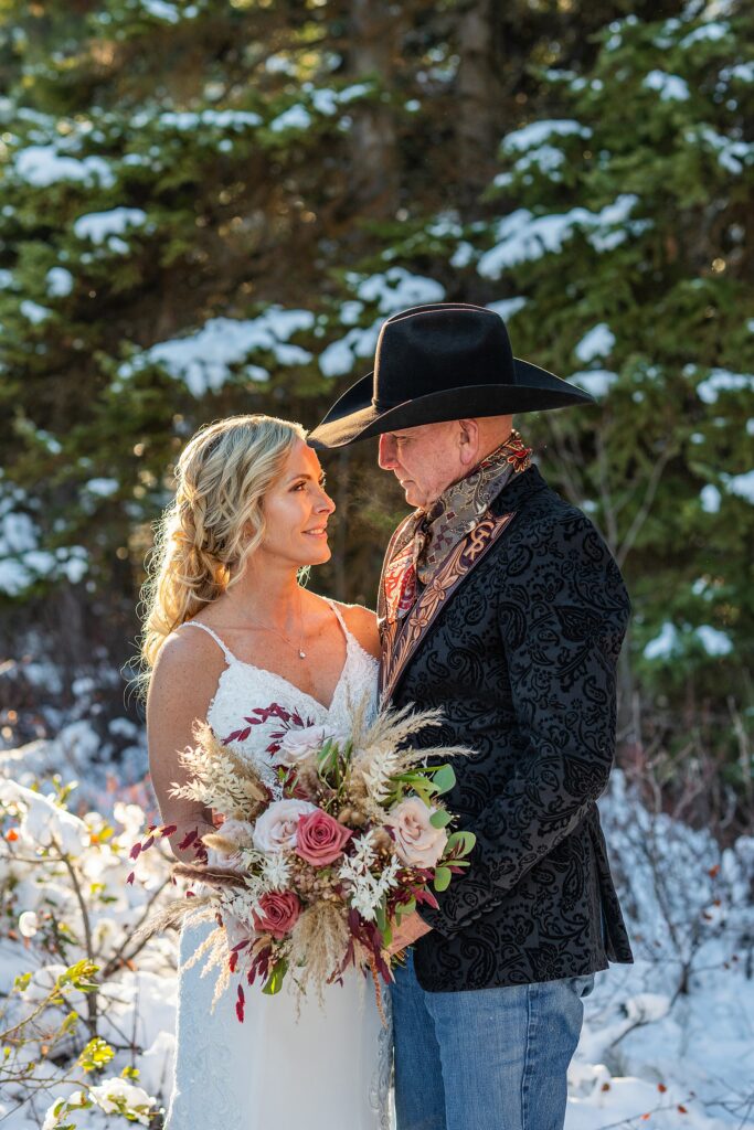 Grand Teton National Park wedding photography October Jenny Lake elopement photos with snow Jackson Hole Wedding Photos Lakeside wedding portraits in late Fall snowy wedding photos