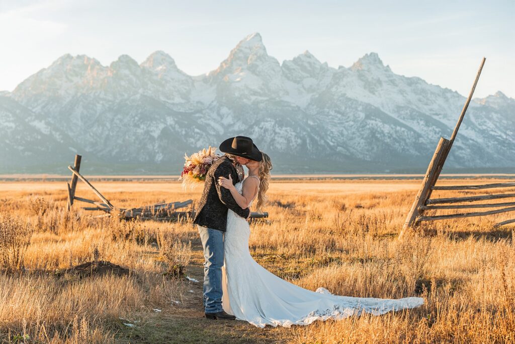 Mormon Row wedding portraits golden hour Rustic mountain wedding with Teton backdrop Cowboy themed groom style mountain wedding Vintage barn wedding photos Jackson Hole