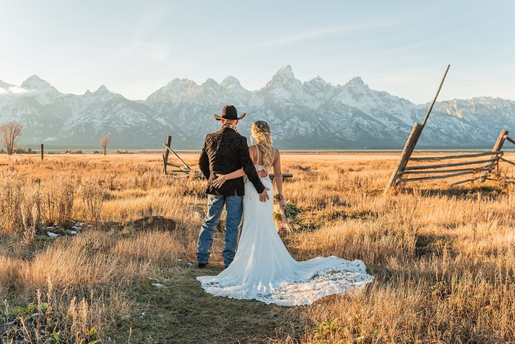 Mormon Row wedding portraits golden hour Rustic mountain wedding with Teton backdrop Cowboy themed groom style mountain wedding Vintage barn wedding photos Jackson Hole