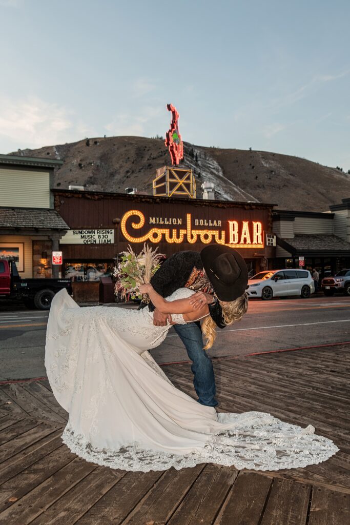Elk Antler Arches wedding photo session Million Dollar Cowboy Bar neon wedding photos