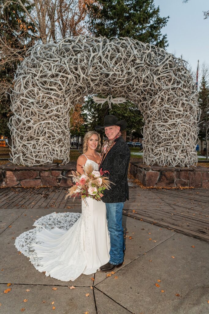 Elk Antler Arches wedding photo session Million Dollar Cowboy Bar neon wedding photos