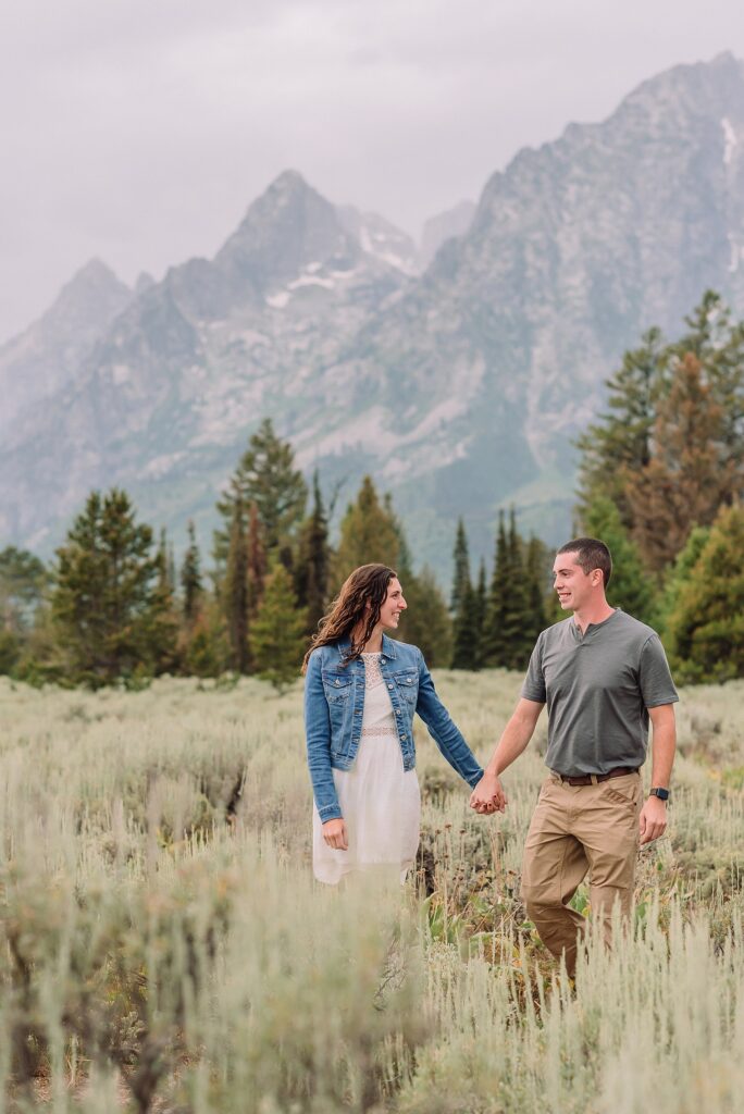 outdoor family photos with baby Grand Tetons purple western shirt family portraits Wyoming cream plaid toddler outdoor photos mountains flexible outdoor photography session inclement weather Jackson Hole Photographer Grand Teton National Park family photographer