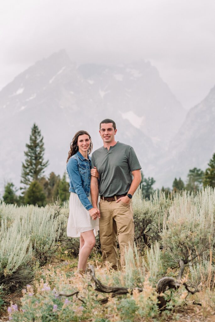 outdoor family photos with baby Grand Tetons purple western shirt family portraits Wyoming cream plaid toddler outdoor photos mountains flexible outdoor photography session inclement weather Jackson Hole Photographer Grand Teton National Park family photographer