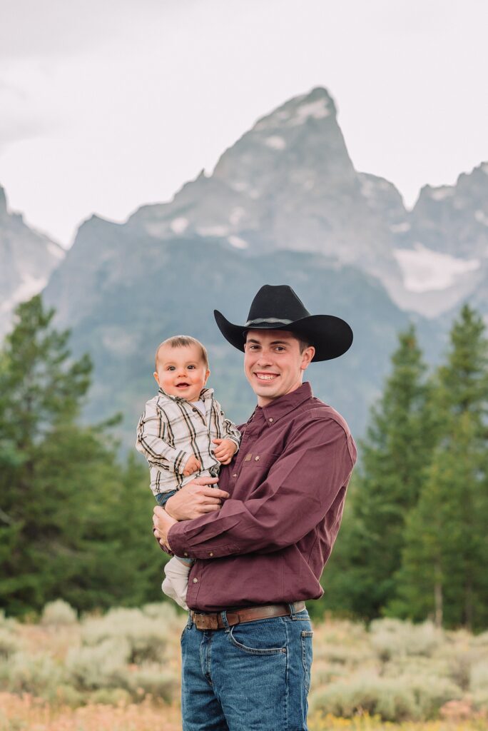 outdoor family photos with baby Grand Tetons purple western shirt family portraits Wyoming cream plaid toddler outdoor photos mountains flexible outdoor photography session inclement weather Jackson Hole Photographer Grand Teton National Park family photographer