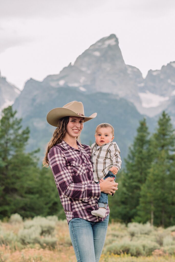 outdoor family photos with baby Grand Tetons purple western shirt family portraits Wyoming cream plaid toddler outdoor photos mountains flexible outdoor photography session inclement weather Jackson Hole Photographer Grand Teton National Park family photographer
