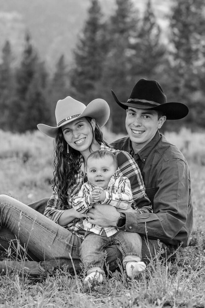 outdoor family photos with baby Grand Tetons purple western shirt family portraits Wyoming cream plaid toddler outdoor photos mountains flexible outdoor photography session inclement weather Jackson Hole Photographer Grand Teton National Park family photographer