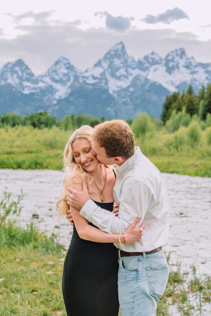 Grand Teton proposal photographer Schwabacher Landing surprise riverside proposal Grand Teton National Park early summer engagement photos Jackson Hole Wyoming mountain backdrop proposal photography Grand Tetons Schwabacher Landing proposal session June natural light proposal photos Grand Teton mountains