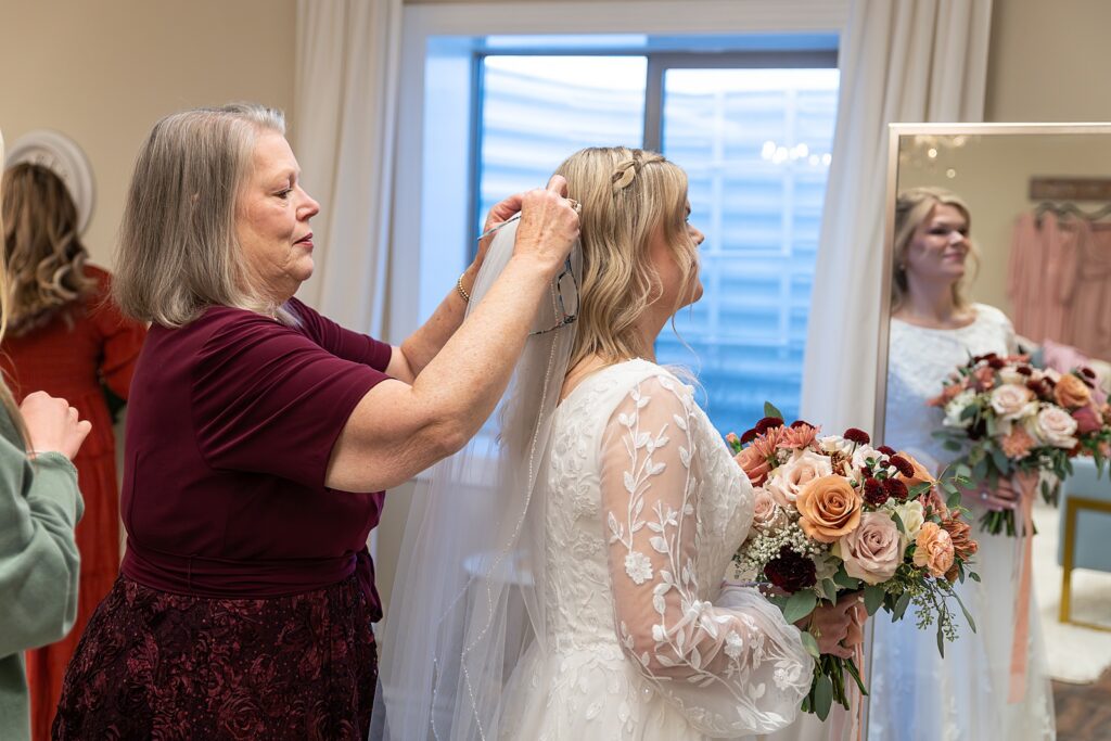 Rexburg Idaho Temple wedding photography in November LDS temple wedding photographer Rexburg Idaho bride getting ready at The Aisle venue Sugar City Idaho bridal party getting ready Sugar City Idaho wedding venue father daughter first look before LDS temple wedding ring ceremony with family and friends Idaho wedding sparkler exit with light sticks at Idaho wedding reception November wedding photography Rexburg Idaho no snow