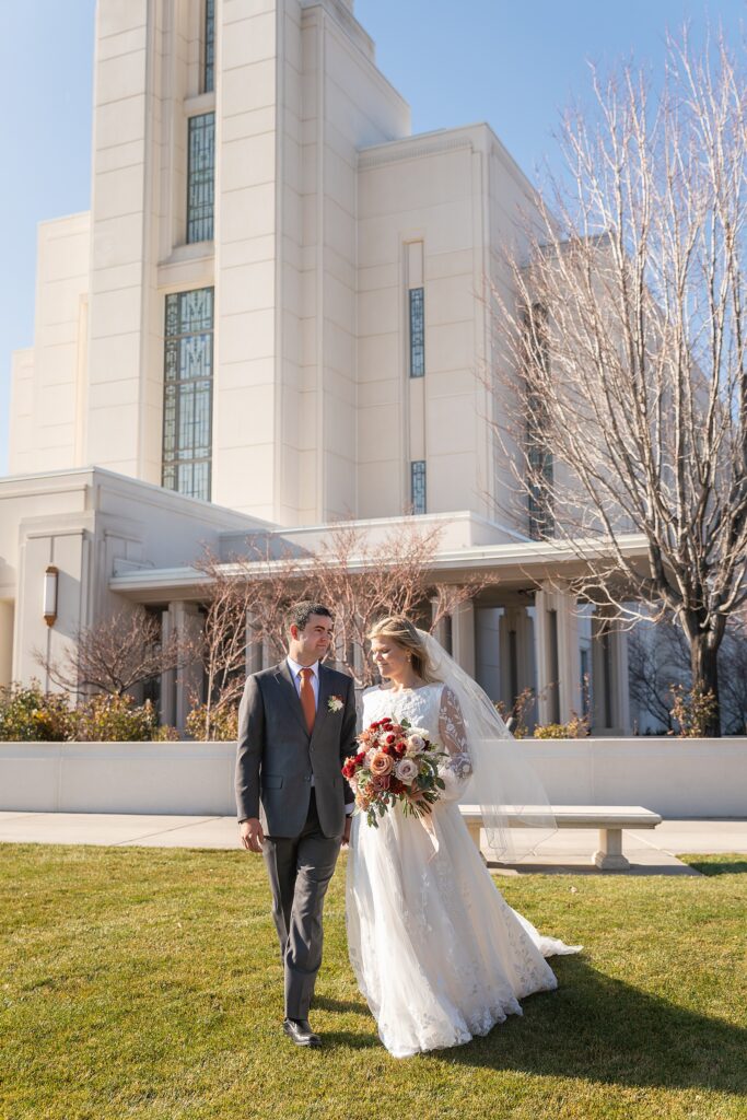 Rexburg Idaho Temple wedding photography in November LDS temple wedding photographer Rexburg Idaho bride getting ready at The Aisle venue Sugar City Idaho bridal party getting ready Sugar City Idaho wedding venue father daughter first look before LDS temple wedding ring ceremony with family and friends Idaho wedding sparkler exit with light sticks at Idaho wedding reception November wedding photography Rexburg Idaho no snow