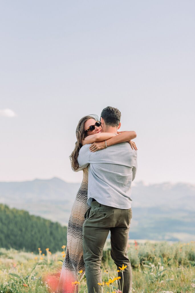 Snow King Mountain surprise proposal photography Jackson Hole wildflower engagement photos gondola engagement session Wyoming Snow King resort proposal photographer wildflower engagement photos Wyoming