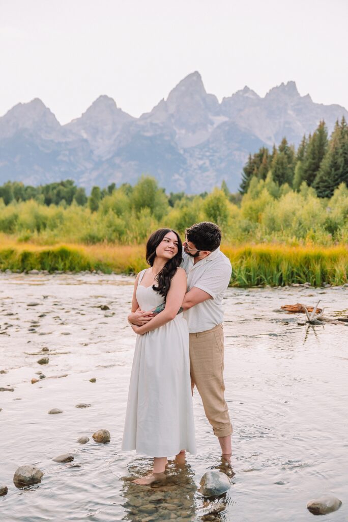 dreamy lighting engagement photography Jackson Hole area romantic Schwabacher Landing couples photography session Grand Teton National Park fall engagement pictures candid mountain engagement photos natural posing Wyoming Jackson Hole Photographer