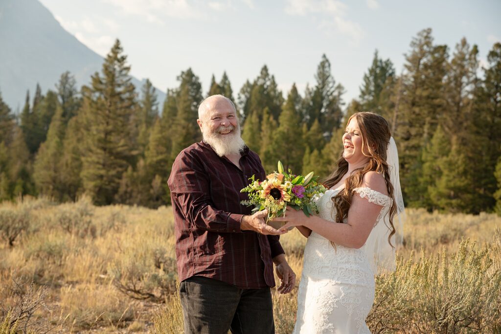 intimate family elopement Teton National Park bride first look with dad mountain backdrop