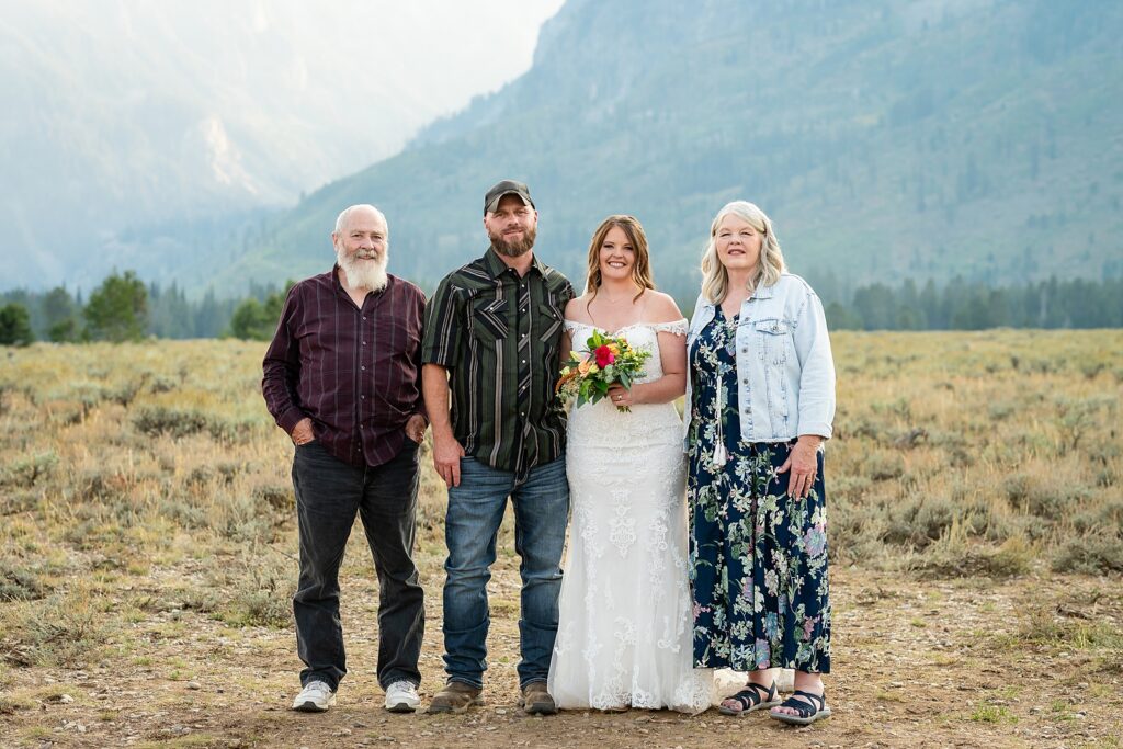 Teton Mountains elopement photography intimate ceremony Cathedral View Turnout wedding photographer Wyoming bride with white cowgirl boots mountain wedding intimate family elopement Teton National Park