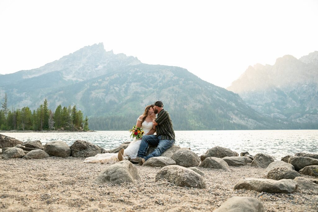Jenny Lake sunset elopement portraits lace wedding gown Teton Mountains elopement Lakeshore wedding photos in Jackson Hole