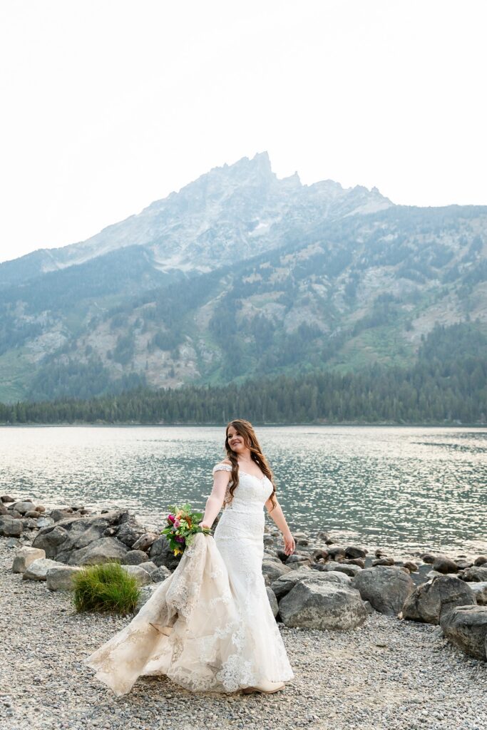 Jenny Lake sunset elopement portraits lace wedding gown Teton Mountains elopement Lakeshore wedding photos in Jackson Hole