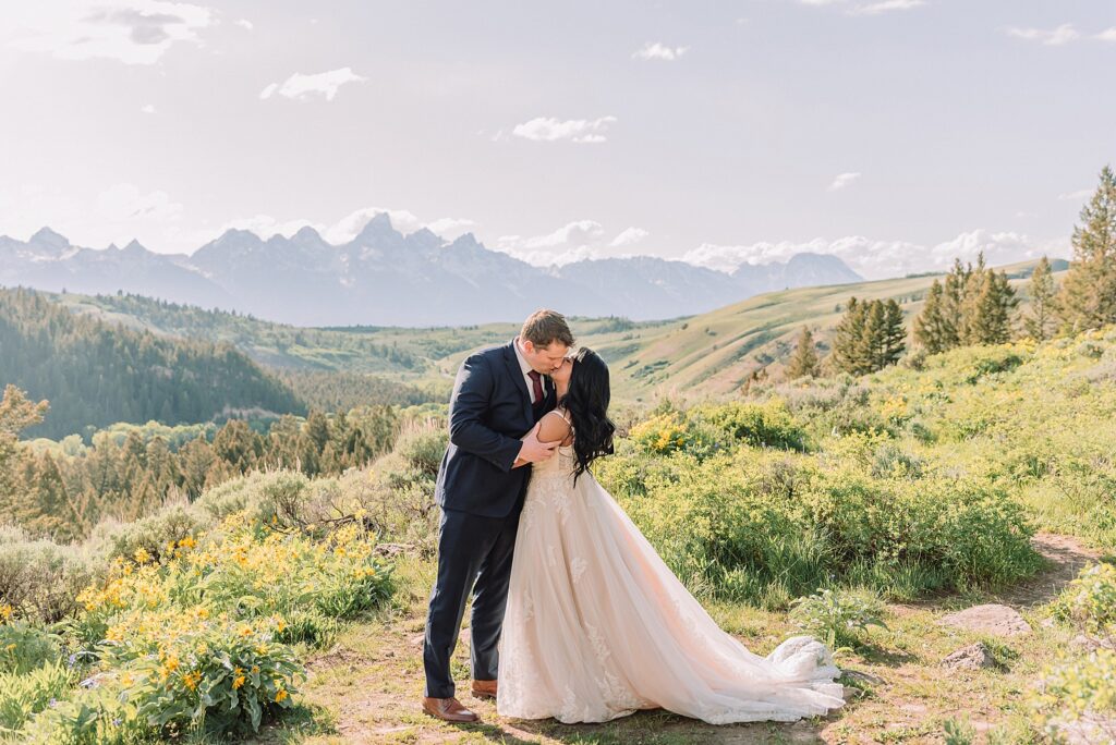Bridger-Teton National Forest wedding ceremony photography The Wedding Tree elopement portraits Jackson Hole June wildflower wedding photography Wyoming mountains candid elopement photography Teton Range backdrop Jackson Hole Wedding Photographer Teton Mountains Wedding Photography