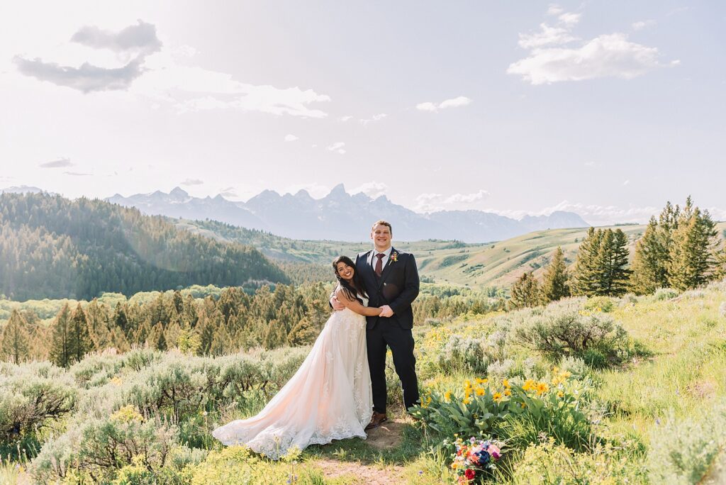 Bridger-Teton National Forest wedding ceremony photography The Wedding Tree elopement portraits Jackson Hole June wildflower wedding photography Wyoming mountains candid elopement photography Teton Range backdrop Jackson Hole Wedding Photographer Teton Mountains Wedding Photography