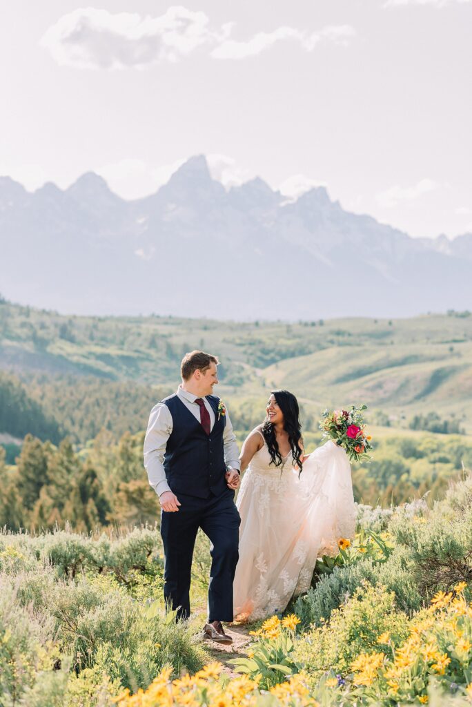 Bridger-Teton National Forest wedding ceremony photography The Wedding Tree elopement portraits Jackson Hole June wildflower wedding photography Wyoming mountains candid elopement photography Teton Range backdrop Jackson Hole Wedding Photographer Teton Mountains Wedding Photography